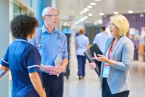 Health workers talking in a hospital